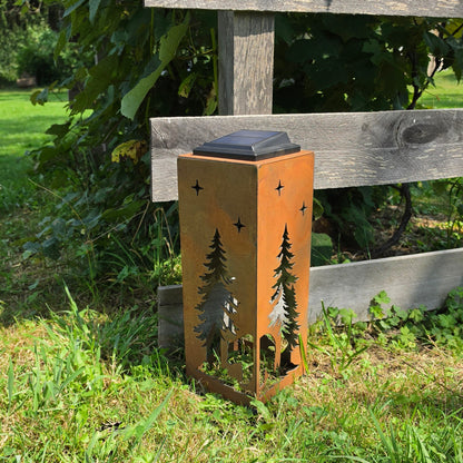 16in Rustic Bear themed solar pillar outdoors by a grape vine