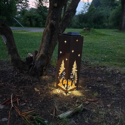 Rustic bear solar pillar outdoors at sunset showing a warm glow