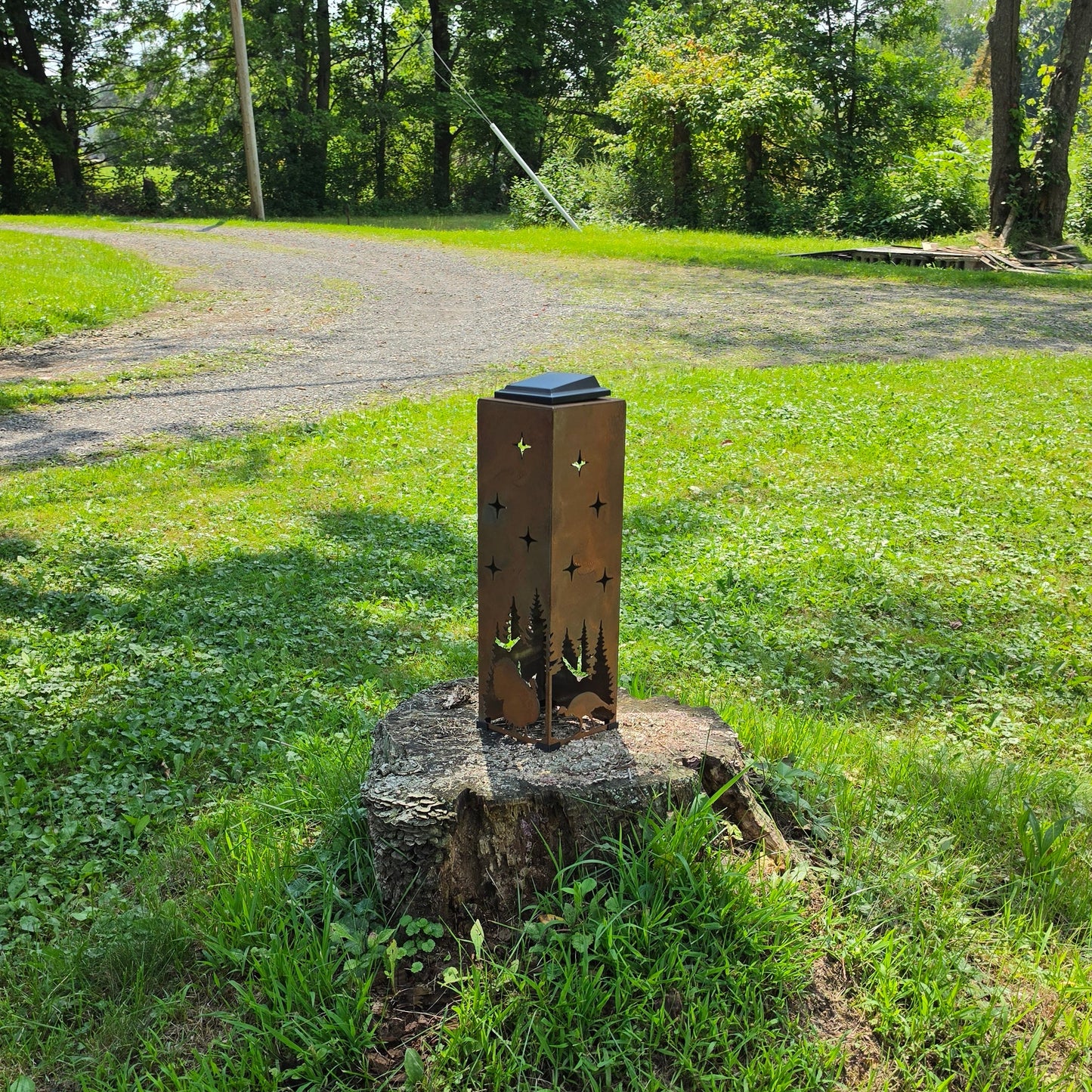 Rustic 20in turkey themed solar pillar outdoors on stump front facing