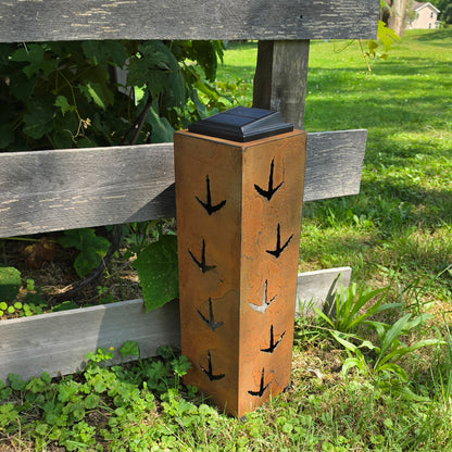 Rustic metal turkey solar pillar 20in tall outdoors rear facing