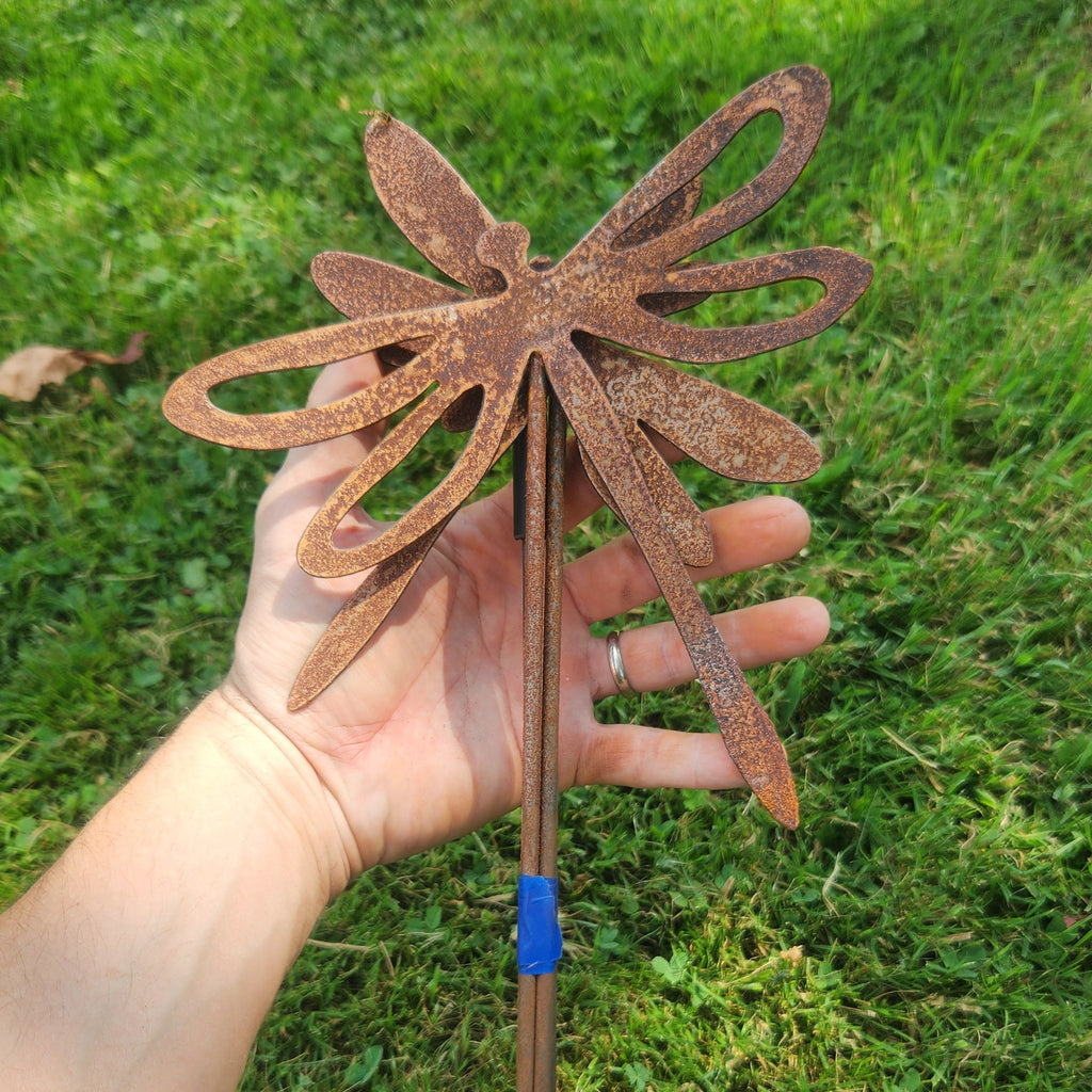 Dragonfly rustic metal plant stakes in a bundle to show size