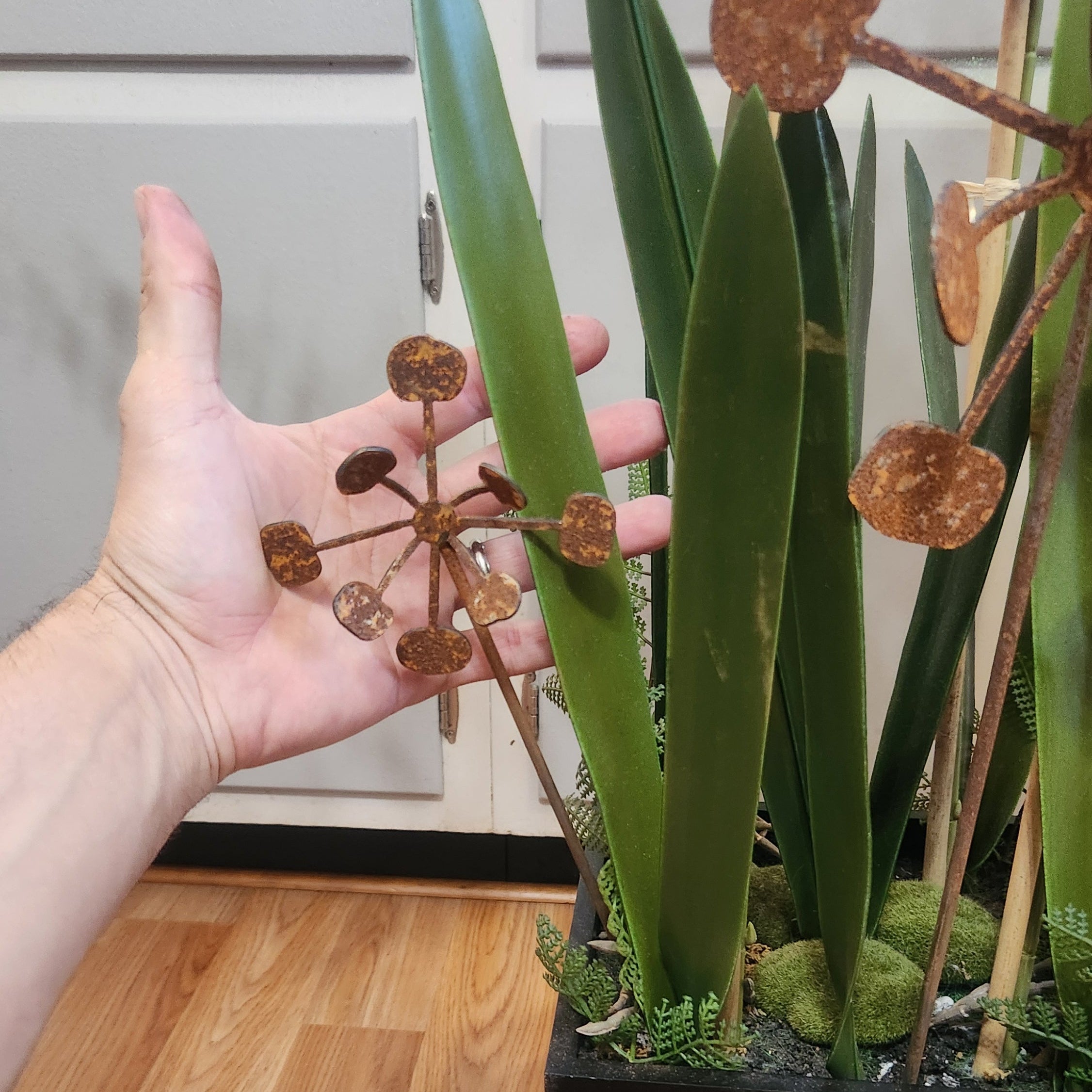 Rustic metal bendable dandelion size comparison.