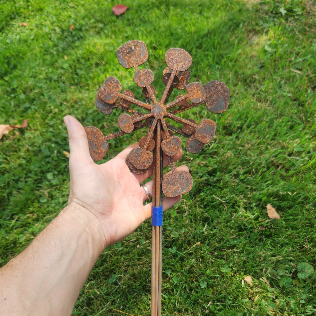 Rustic metal bendable dandelion plant stakes in a bundle of different sizes.