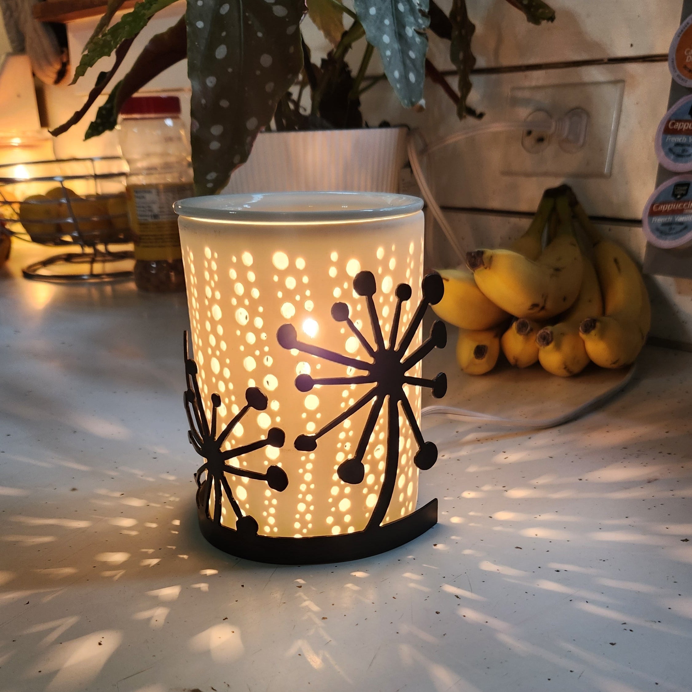 Elegant black powder coated candle wrap of dandelions