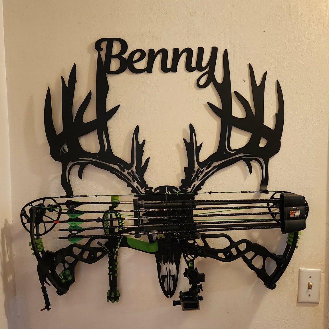 Metal deer skull bow rack holding compound bow