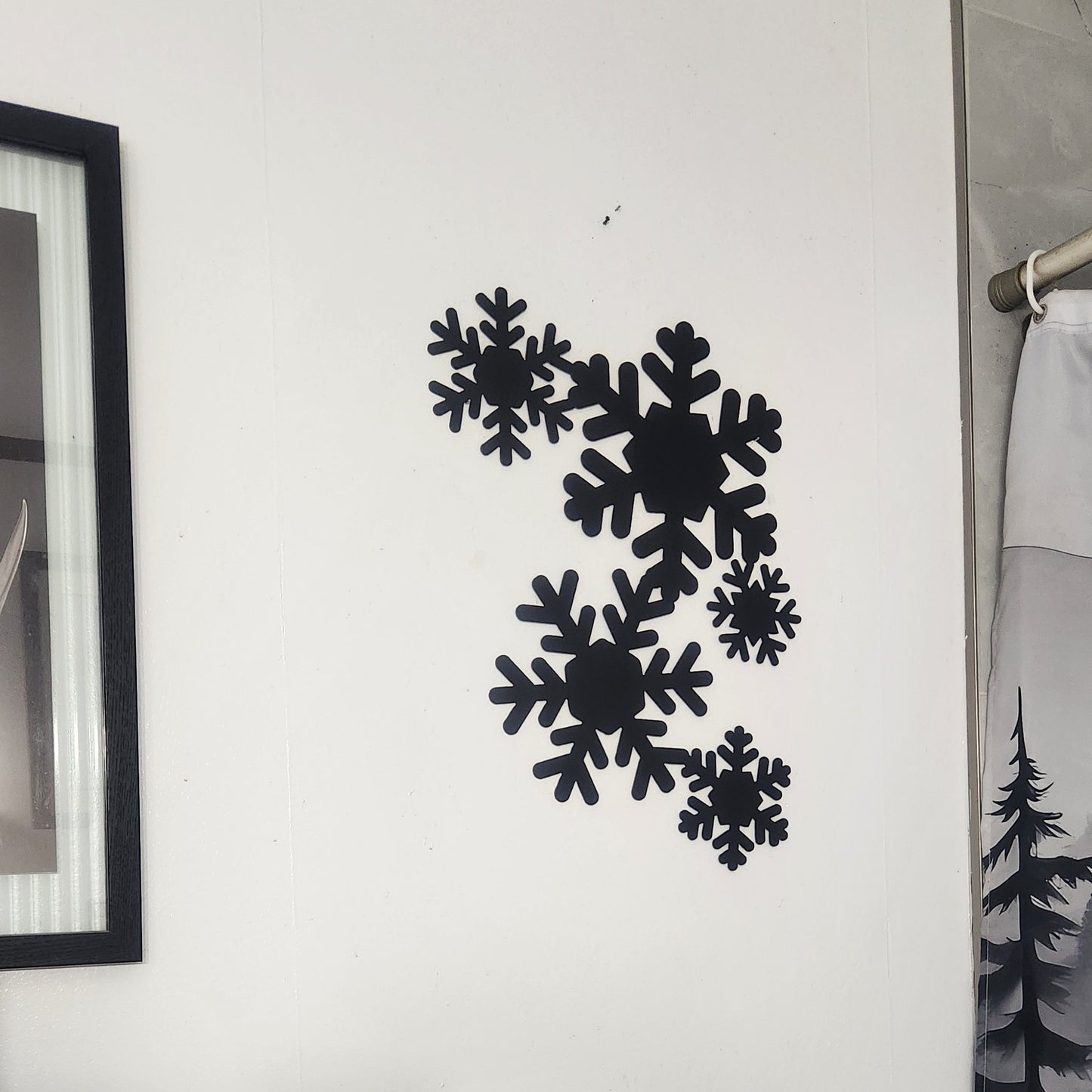 black snowflakes on white wall