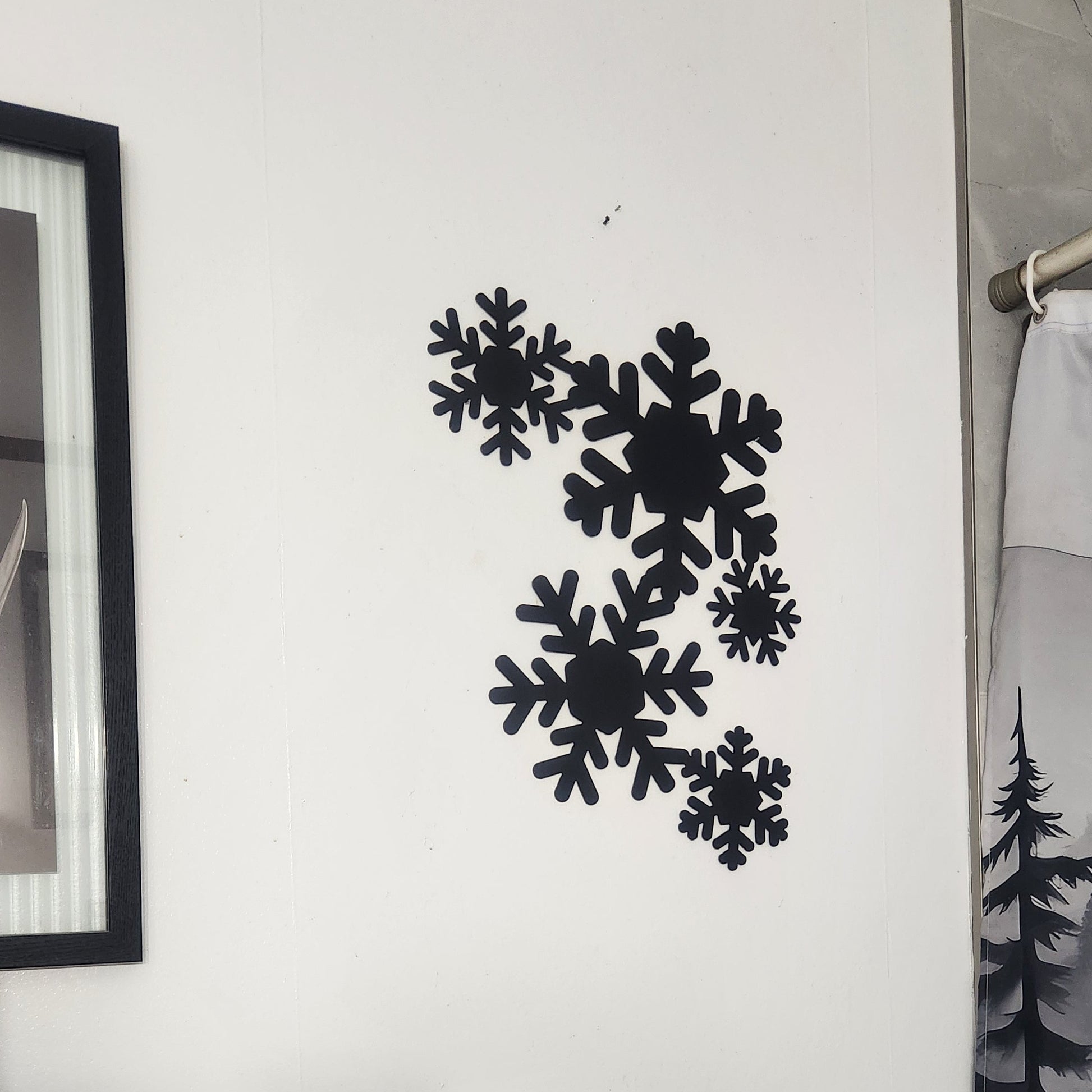 black snowflakes on white wall
