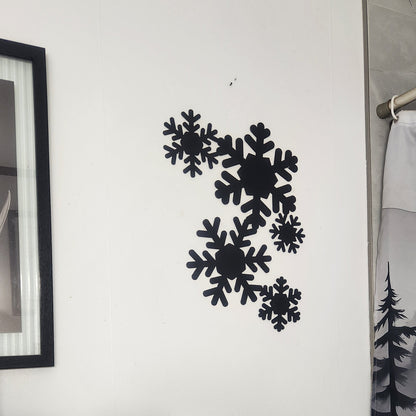 black snowflakes on white wall