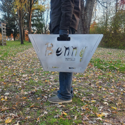 Person holding the custom name collapsable fire pit 