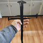 Large black steel cross shaped like a nail
