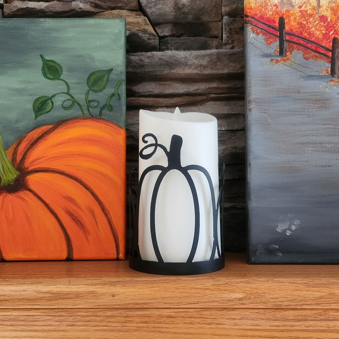 Metal candle wrap resembling a pumpkin