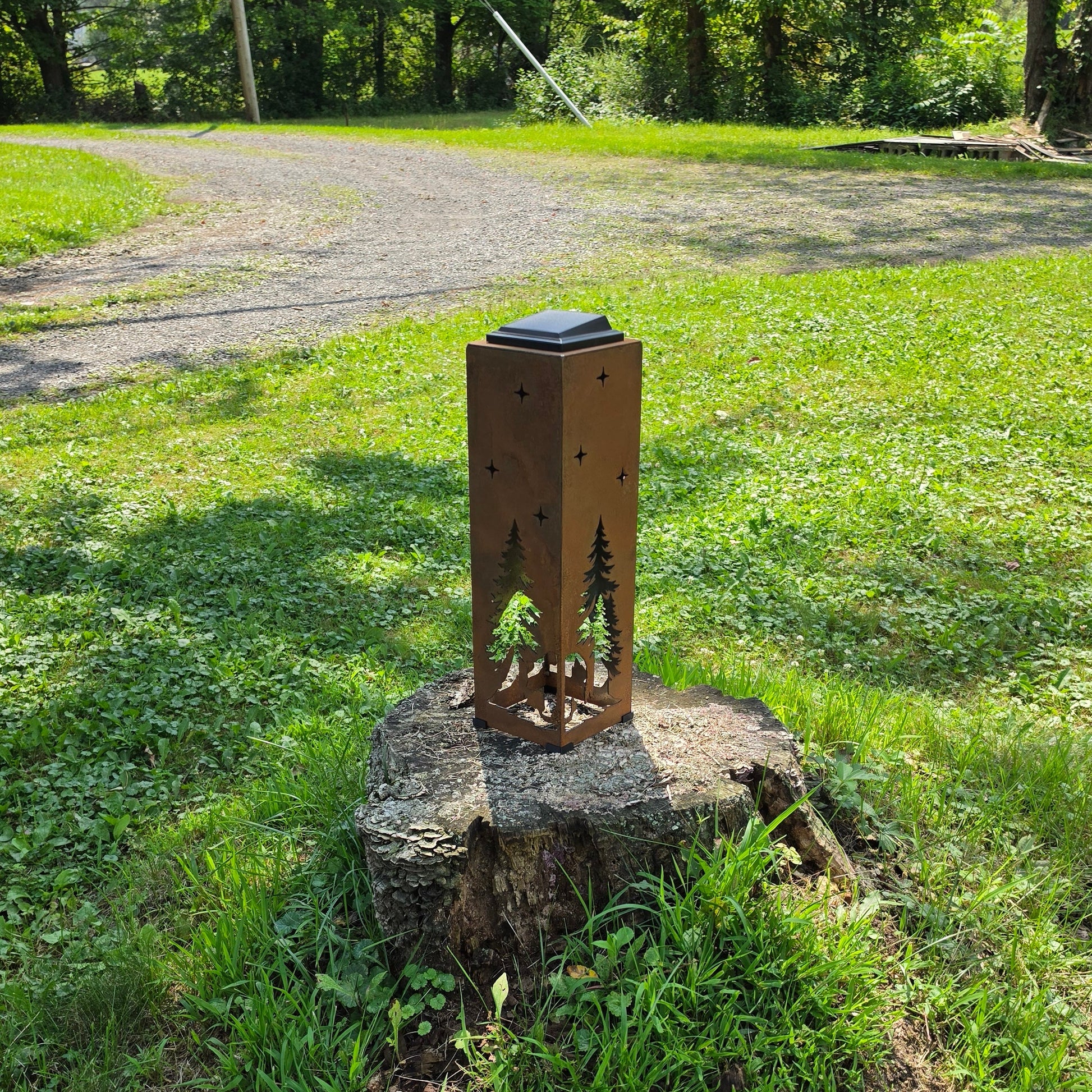 Rustic Bear solar Pillar displayed on a stump outdoors