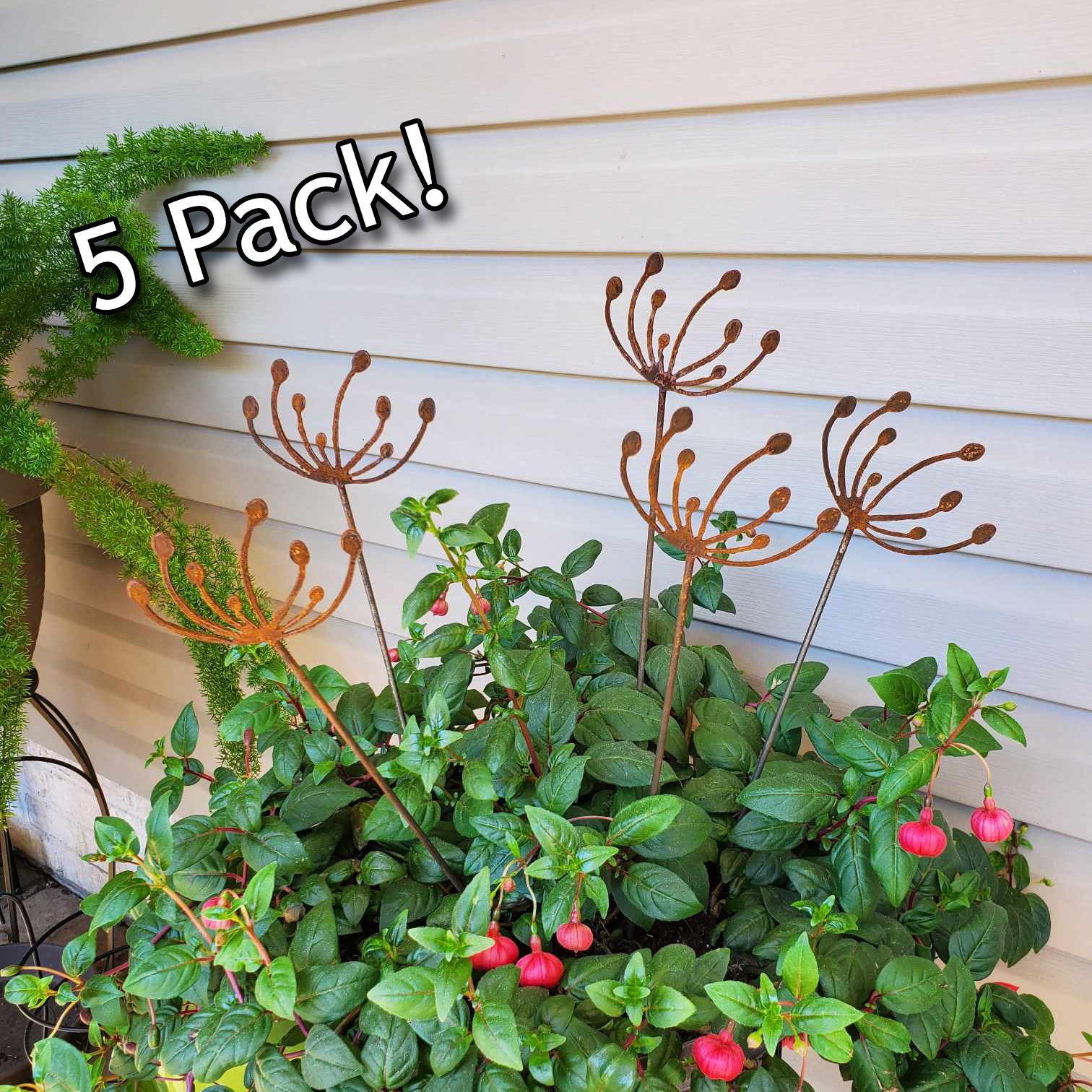 5 pack of rustic metal wind swept dandelions in a potted plant.