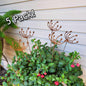 5 pack of rustic metal wind swept dandelions in a potted plant.