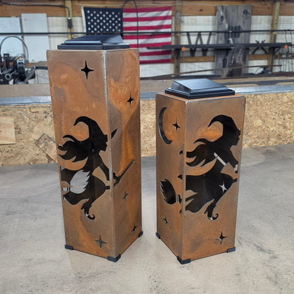 Rustic metal solar pillar lanterns with witch designs