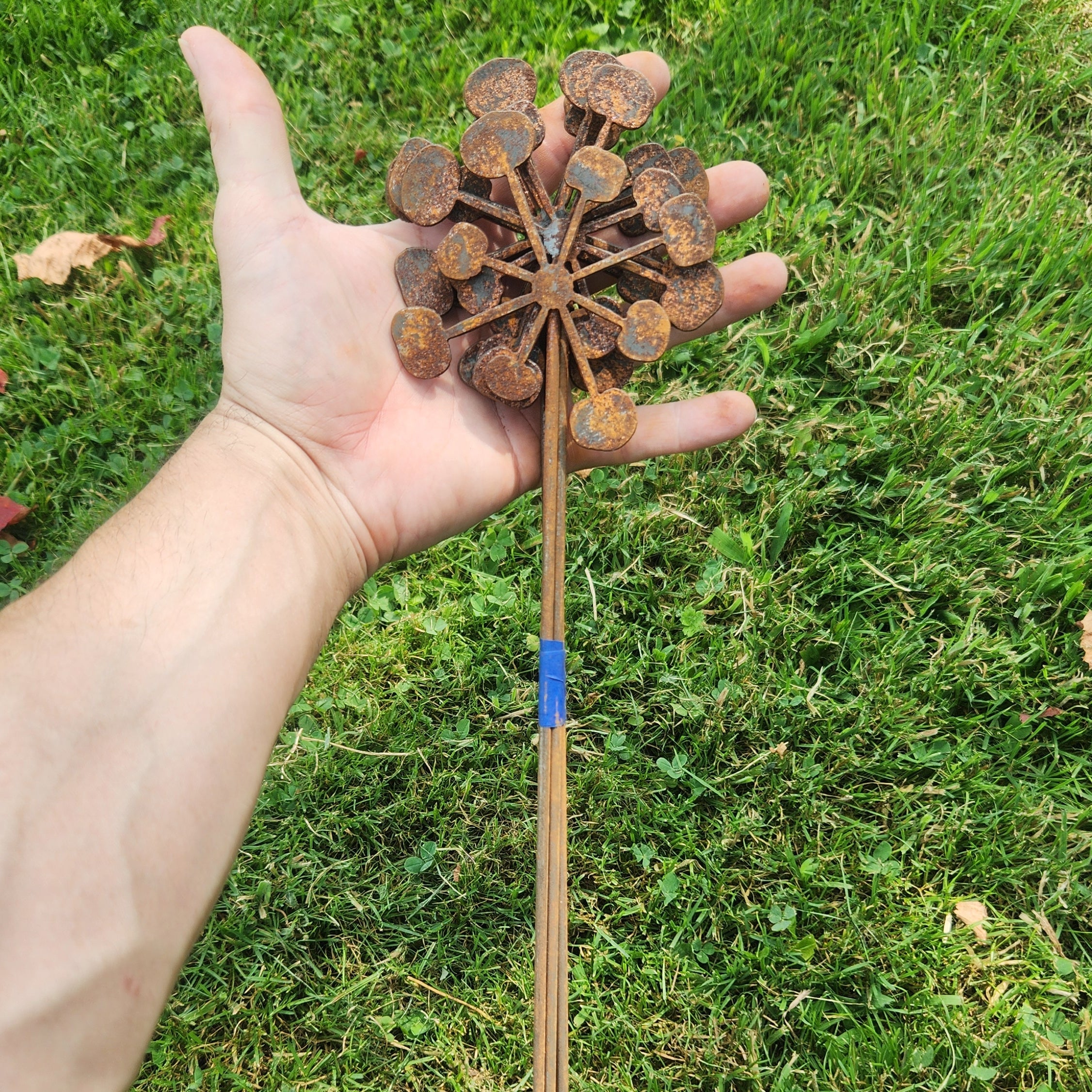 Rustic metal bendable dandelion bundle up close.