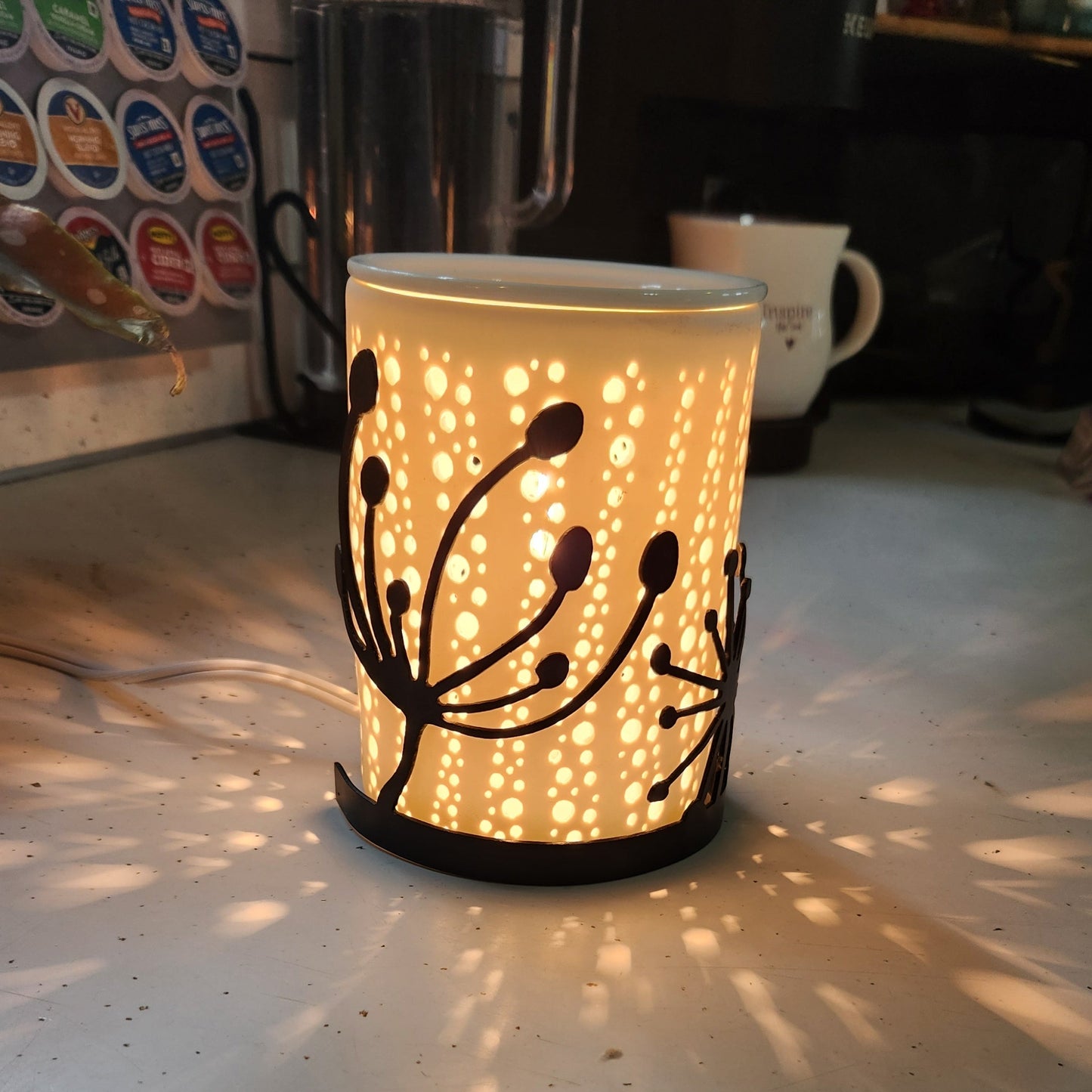 Dandelion candle wrap on a wax warmer