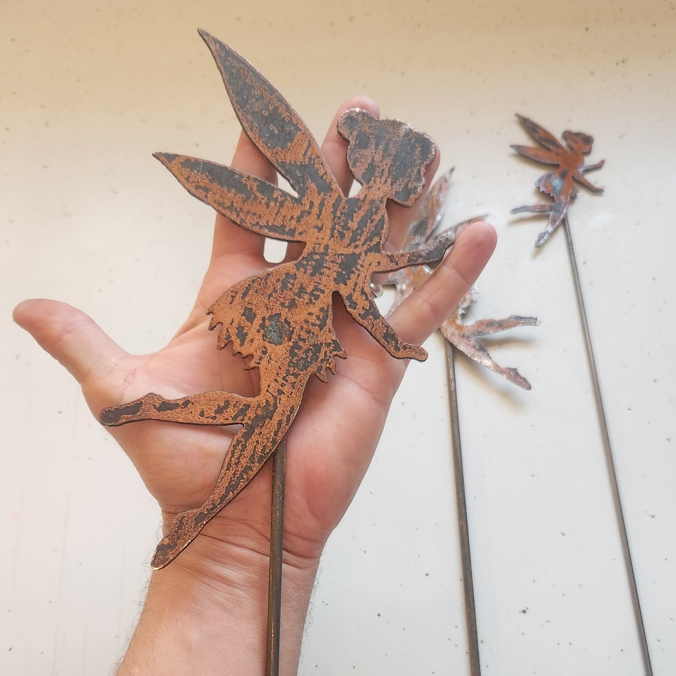 Rustic metal fairy plant stake size comparison