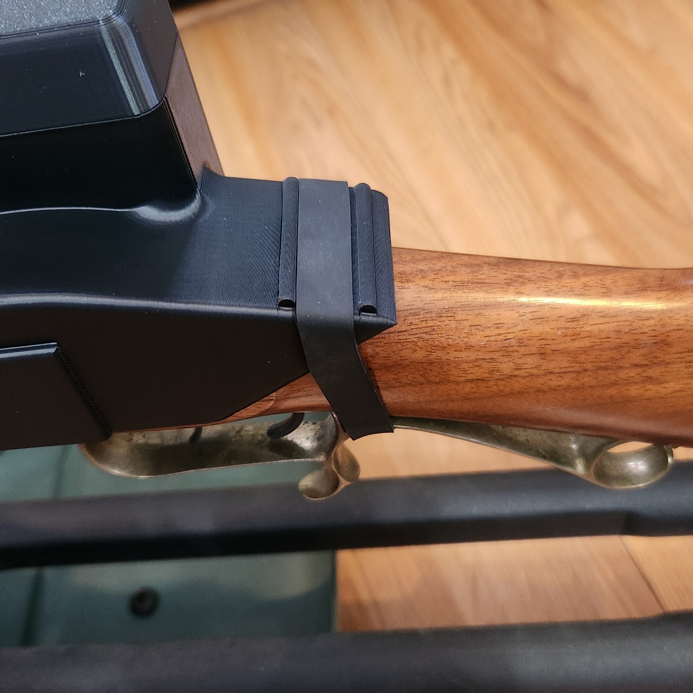 close up of the rear rubber band positioning on the flint lock gun cover