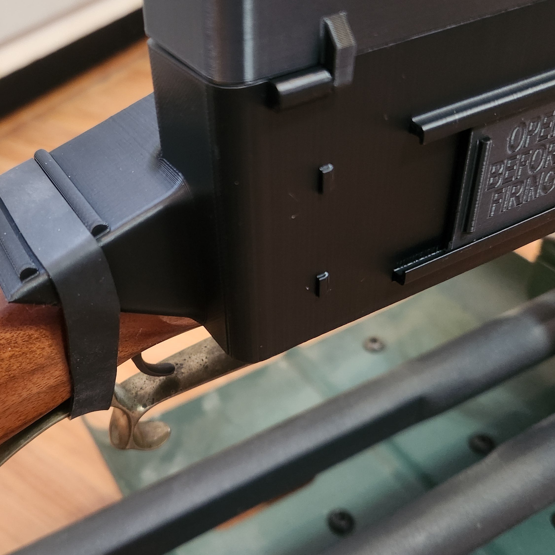 close up of the flint lock cover showing the rubber band attachment