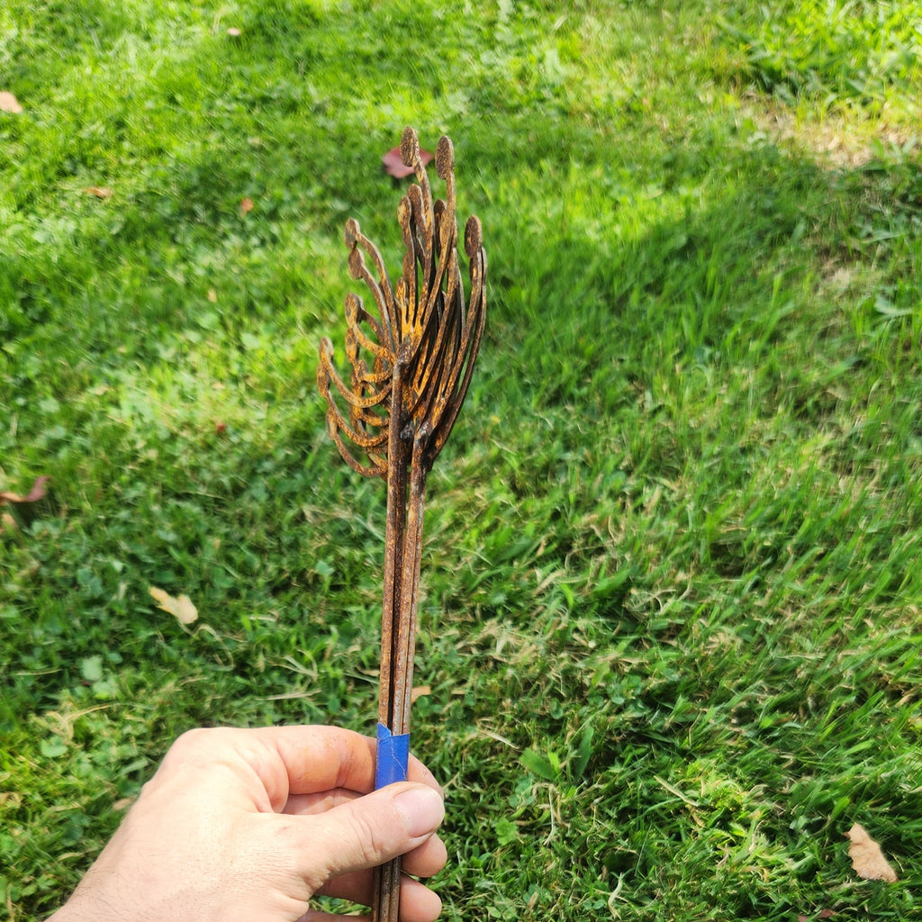 Wind swept dandelion rustic metal plant stakes side view of bundle.